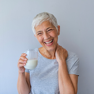 Woman holding a glass of milk
